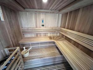 an empty wooden sauna with a wooden floor at Snowbasin + Powder Mountain + Spa + Eden in Eden