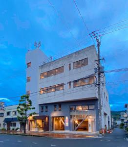 a building on the corner of a street at HAJIMARI Beppu in Beppu