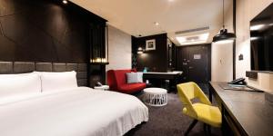 Voodi või voodid majutusasutuse Hotel Château Anping toas