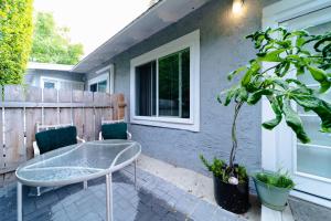 a patio with a table and two chairs and a tree at Cozy 1 BR in Historic SD Walk to Restaurants in San Diego