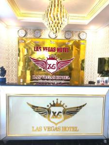 a sign for a las vegas hotel with wings on it at LAS VEGAS HOTEL in Quang Ninh