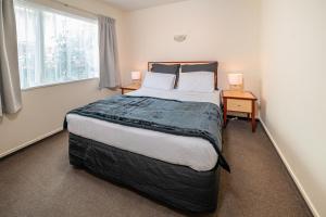 Postel nebo postele na pokoji v ubytování Daffodil Motel