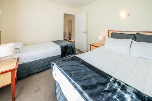 Postel nebo postele na pokoji v ubytování Daffodil Motel