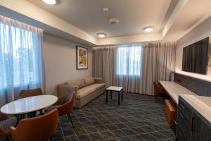 a living room with a couch and a table at The Gable Inn in Scone