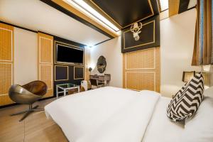 Ένα ή περισσότερα κρεβάτια σε δωμάτιο στο Gongju No 25 Hotel