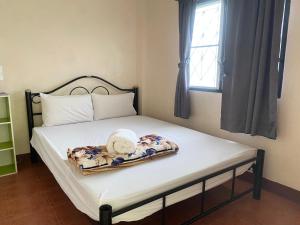 מיטה או מיטות בחדר ב-Baan Jaidee Guesthouse