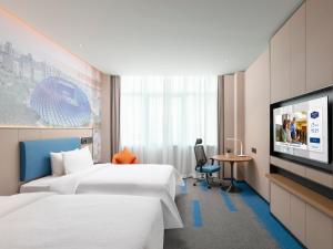 TV a/nebo společenská místnost v ubytování Hampton by Hilton Beijing Bird's Nest + 15 fotografií
