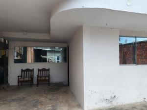 two chairs sitting in a room with a wall at Departamento amoblado in Pucallpa