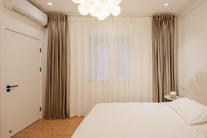 Tonight Aparthotel Jing'an Temple Shanghai客房内的一张或多张床位