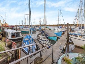 a bunch of boats docked in a harbor at Cos I Can - Uk45570 in Maldon