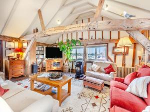 a living room filled with furniture and a tv at Sail Loft-uk45571 in Maldon
