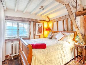 a bedroom with a large bed in a room at Sail Loft-uk45571 in Maldon