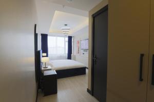 Tempat tidur dalam kamar di Ravello Suites Taksim