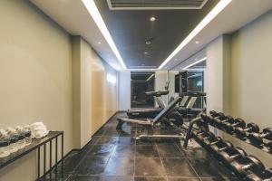 a gym with cardio equipment in a hotel room at Atour Hotel East Nanjing Road Near The Bund in Shanghai