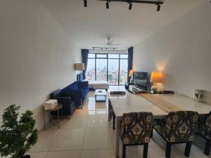 a living room with a couch and a table at Beacon Executive Suites - Penang in George Town