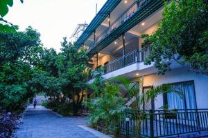 a building with a walkway in front of it at Bageecha Resort in Pushkar