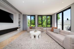 a living room with a couch and a table at The Gratis Deepdene in Melbourne