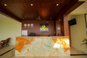 a lobby with a large marble counter in a building at SPARV Aulakhs Resort in Mandrem