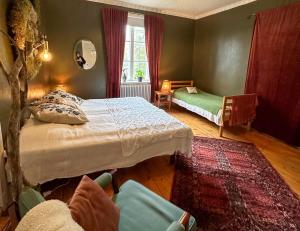Postel nebo postele na pokoji v ubytování Fridhem Coursecenter & Guesthouse