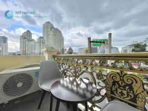 a balcony with a table and chairs on a balcony at Moon Apartment in Ho Chi Minh City
