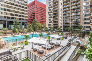 an apartment patio with a pool and buildings at Crystal City 1BR w Gym Concierge nr Metro WDC-445 in Arlington