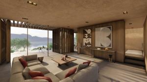 a living room with a couch and a table at Lujo Hotel Bodrum in Guvercinlik