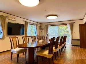 a dining room with a table and chairs at Chateau Ange UMAYA - Vacation STAY 68831v in Tsumagoi