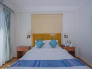 Ein Bett oder Betten in einem Zimmer der Unterkunft Hotel Bodhiz TUSAL