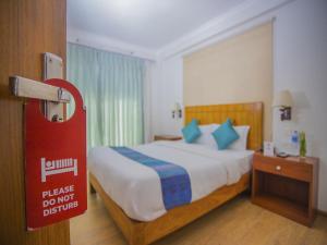 Ein Bett oder Betten in einem Zimmer der Unterkunft Hotel Bodhiz TUSAL