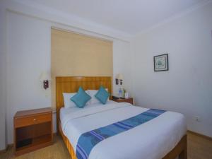Ein Bett oder Betten in einem Zimmer der Unterkunft Hotel Bodhiz TUSAL