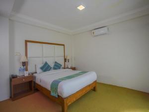 Ein Bett oder Betten in einem Zimmer der Unterkunft Hotel Bodhiz TUSAL