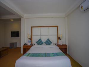 Ein Bett oder Betten in einem Zimmer der Unterkunft Hotel Bodhiz TUSAL