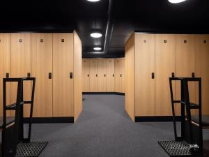 a room with wooden lockers in a gym at Kikut Alpin Lodge Ski in - Ski out in Geilo