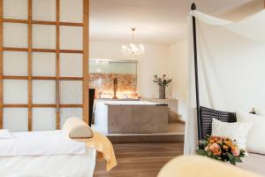 Postel nebo postele na pokoji v ubytování Thermenwelt Hotel Pulverer