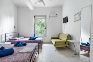 Postel nebo postele na pokoji v ubytování Villa Porto katsiki + 19 fotografií