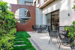 a patio with chairs and a table on a building at Atour Hotel Shanghai Xianxia in Shanghai