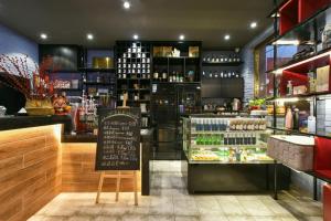 a restaurant with a counter and a store with drinks at Atour Light Hotel Beijing Jianguomen CBD in Beijing