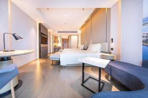 Voodi või voodid majutusasutuse Atour S Hotel Zhuhai Gongbei Port NetEase Selected toas