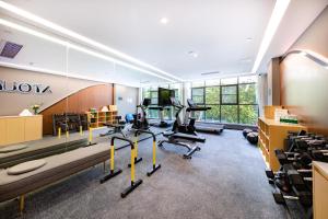 a gym with treadmills and exercise bikes in a room at Atour Hotel Shenzhen Nanshan Xili Station in Shenzhen