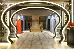 a staircase in a building with an archway at Atour Light Hotel Beijing Jianguomen CBD in Beijing