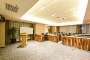 a conference room with tables and chairs and a whiteboard at Atour Hotel Shenyang Youth Street Golden Gallery in Shenyang