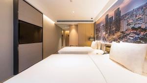 Postel nebo postele na pokoji v ubytování Atour Hotel Chengdu Jiuyanqiao NetEase Selected