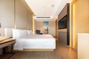 Voodi või voodid majutusasutuse Atour S Hotel Zhuhai Gongbei Port NetEase Selected toas