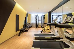 a gym with treadmills and elliptical machines at Atour Hotel Guangzhou Huadu Square in Huadu