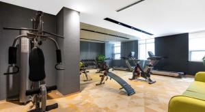 a gym with treadmills and cardio equipment in a room at Atour Hotel Xining East Kunlun Road in Xining