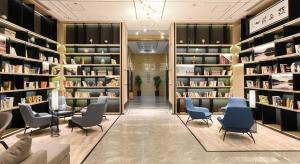 a library with chairs and bookshelves at Atour Hotel Shenyang Youth Street Golden Gallery in Shenyang