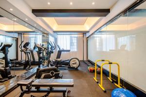 a gym with treadmills and elliptical machines at Atour X Hotel Chaozhou Xiangqiao International Financial Business Center in Chaozhou