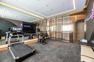 a room with a gym with a treadmill and a television at Atour X Hotel Chengdu Shuangnan Wuhou Avenue Station in Chengdu