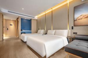 Ένα ή περισσότερα κρεβάτια σε δωμάτιο στο Atour S Hotel Xining Haihu New District SDIC Plaza