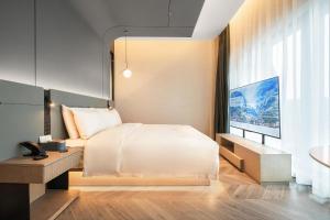 Postel nebo postele na pokoji v ubytování Atour S Hotel Chengdu Kuanzhai People's Park Station